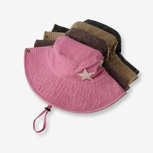 Detailed close-up of colorful sun hats with star patches and adjustable chin straps