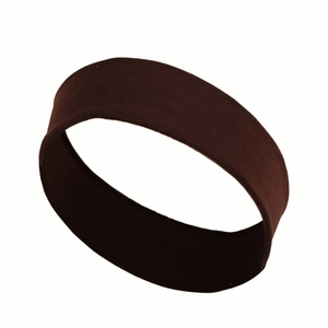 Close-up of soft dark brown elastic sweatband with a premium woven texture for fitness