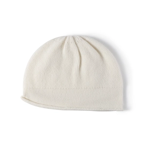 Minimalist white knitted beanie hat in soft wool for women, winter outdoor fashion style