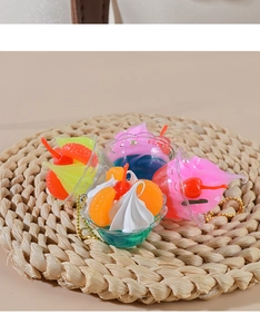 Macro top view of four assorted miniature cream sundae dessert keychain charms