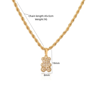 Detailed view of a gold bear pendant necklace with dimensions 19x8mm and rope chain