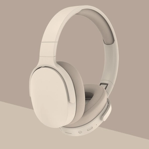Foldable beige wireless gaming headphones with padded ear cups and ergonomic design