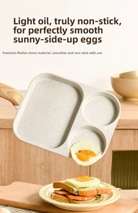 Maifan stone non-stick 3-section pan showing fried eggs sliding off easily with wood handle