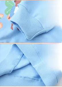Detailed view of ribbed cuffs and hem on a light blue toddler long-sleeved sweatshirt