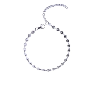 Minimalist silver stainless steel chain bracelet with engraved round charms on white background