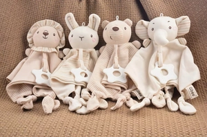 Detail view of organic cotton baby security blankets with teether and animal head toys