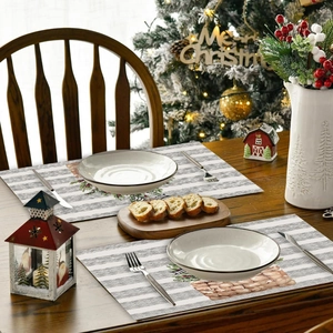 Christmas placemats with woven basket and pine cone patterns on striped fabric background