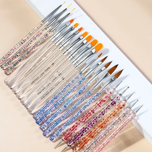 Macro shot of assorted professional nail art brushes and dotting tools with glitter handles