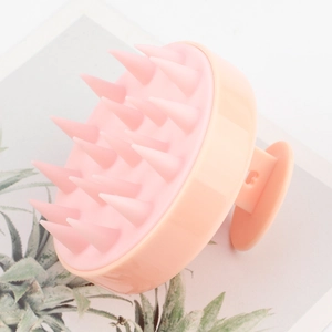 Pink silicone scalp massage brush with 19 soft teeth for hair washing and scalp care
