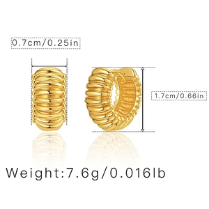 Detail view of 18K gold plated oval hoop earrings showing ribbed texture and dimensions