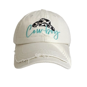 Beige baseball cap with Cowboy embroidery and distressed brim details on white background
