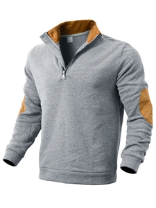 Detail of grey men's 1/4 zip sweatshirt featuring brown elbow patches and stand collar