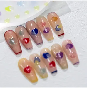 Detail of jelly-textured heart nail art stickers with colorful hand-painted patterns
