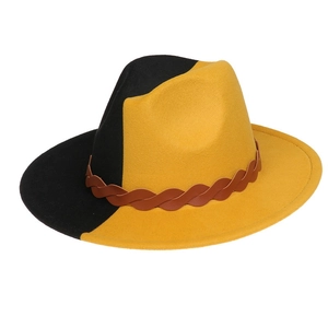 Detail of yellow and black bicolor wool fedora hat with brown braided leather band