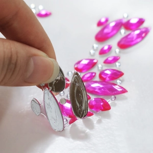 Pink and silver self-adhesive face gems for party makeup and body decoration