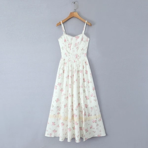 Detail of floral spaghetti strap dress with delicate lace trim and smocked waist design