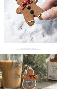 Scène festive avec un pendentif bonhomme de pain d'épices, branches de pin et café