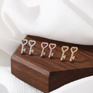 Three-color S925 sterling silver heart-shaped key earrings with pave-set diamond accents