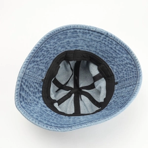 Detailed internal view of washed denim bucket hat with black sweatband and reinforced stitching