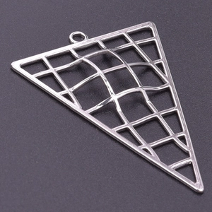 Macro view of triangular stainless steel pendant with grid pattern for DIY jewelry