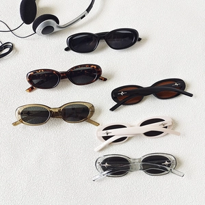 Retro oval sunglasses with star detail in six assorted colors on a white surface