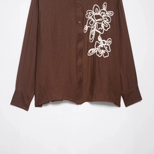 Dark brown cotton linen long sleeve shirt with white floral embroidery on chest