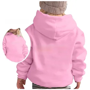 Detail of pink kids hoodie featuring Chasing Sunsets back print and loose fit