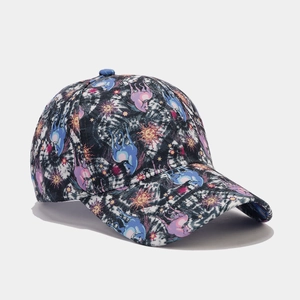 Detail of baseball cap fabric with sun moon stars pattern and tie-dye dark blue finish