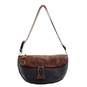 Brown vintage crossbody chest bag with adjustable strap and textured fabric contrast