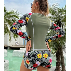 Women's long sleeve two-piece surf suit with tropical floral print and olive green top