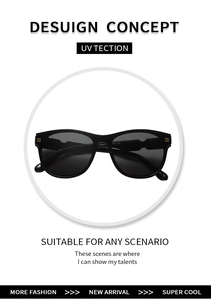 Detail of black oval sunglasses featuring elegant gold metal accents on the temple hinge