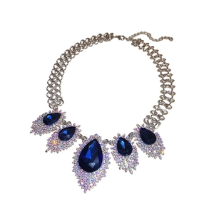 Ornate French vintage necklace with deep blue teardrop gems and sparkling rhinestones