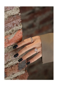 Detailed view of silver beaded ring and irregular vine ring with translucent agate stone