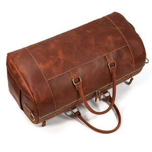 Top view of large brown crazy horse leather travel duffel bag with smooth metal zipper