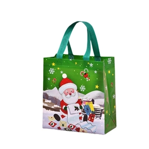 Green Christmas non-woven gift bag with Santa Claus print and sturdy handles