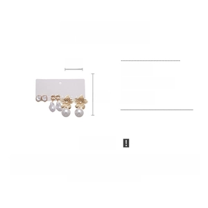 Detailed view of 6-piece metal flower faux pearl earring set with size and weight info