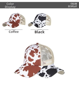 Detail view of cow print trucker hats featuring mesh back in coffee and black colors
