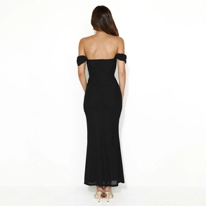 Detail view of ruched back design and slim fit silhouette on black off-shoulder maxi dress