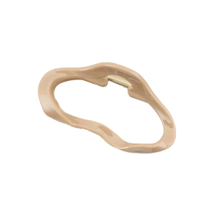 Irregular khaki resin hair claw clip with golden metal spring on white background