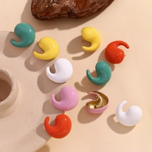Macro shot of colorful comma-shaped enamel stud earrings with 18K gold plated metal finish