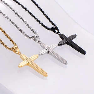 Three minimalist cross necklaces for men in gold, silver, and black finishes