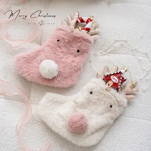 Pink and white plush reindeer Christmas stockings with glitter antlers in two-piece set