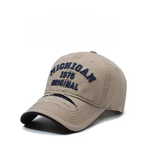 Detail of khaki cotton baseball cap with Michigan embroidery and distressed brim details