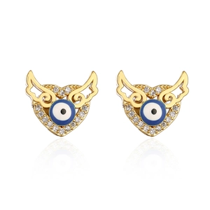 Detail of 18K gold-plated wing earrings featuring a blue evil eye and sparkling zircons