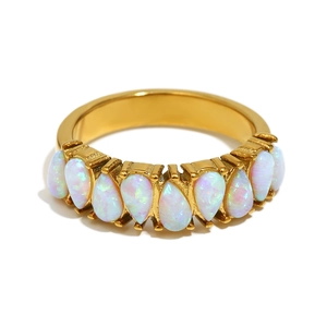 18K gold plated stainless steel ring featuring seven teardrop shaped white opal stones