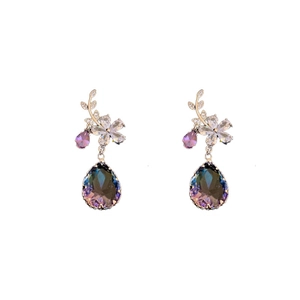 Elegant floral branch earrings with purple crystals and teardrop gemstones on white background
