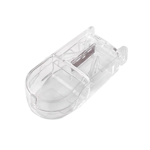 Transparent pill cutter with metal blade for precise splitting on white background