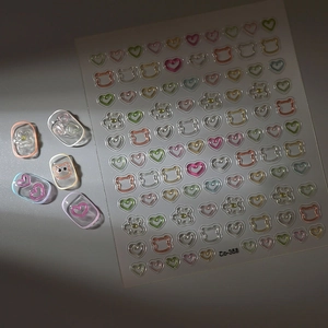 Detailed 3D relief nail stickers featuring macaron-colored bears and heart shapes