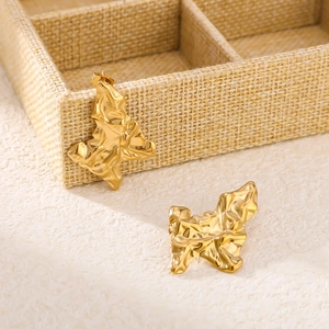 Artistic twisted North Star earrings in gold stainless steel with polished finish