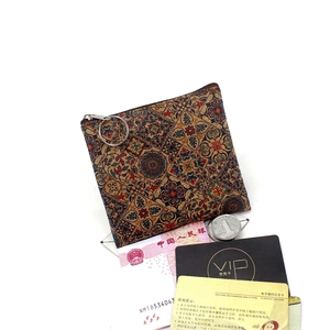 Detail of retro cork pattern coin purse with mandala print and large silver metal ring hook